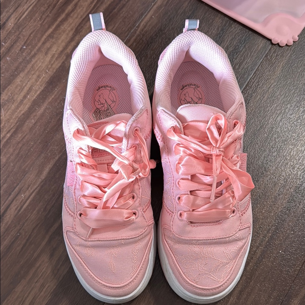 Pink Fila sneakers with satin ribbon laces